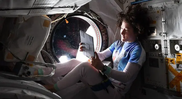astronaut holding a tablet