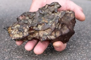 iron meteorite held in hand