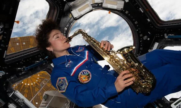 astronaut playing saxophone in space