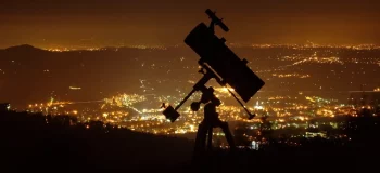 telescope above city and light pollution